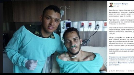 Imagem Neto posa para foto ao lado de policial que o resgatou